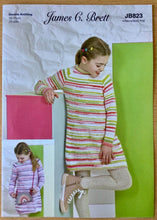 Load image into Gallery viewer, James C Brett DK pattern JB823 Childs Sweater Dress in Partytime Stripes  DK
